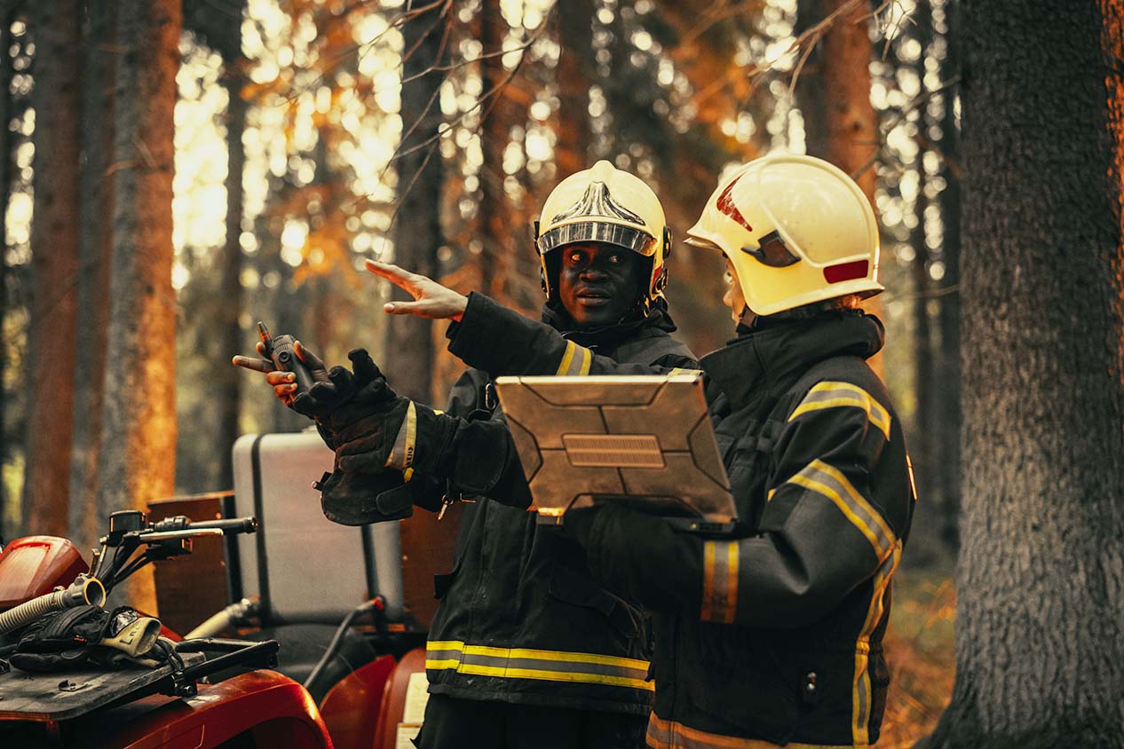 Firefighters communicating on scene.